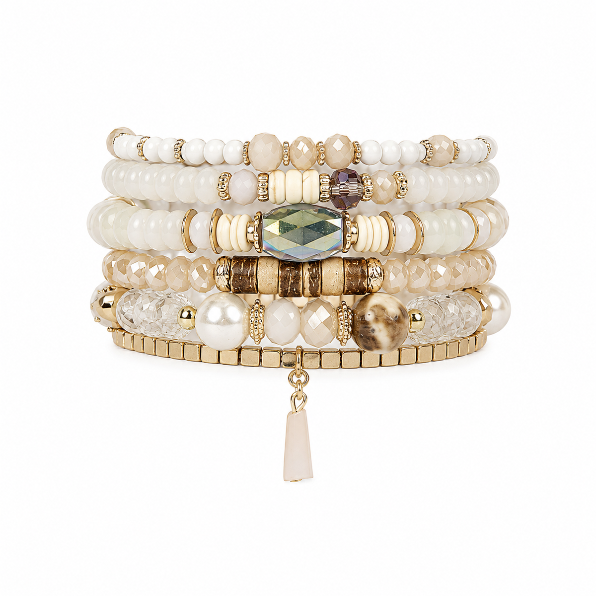 A stack of five beaded stretch bracelets with gold-tone metal accents, featuring cream, white, and beige beads, textured stone details, and a central faceted green gemstone, with a small dangling tassel charm.