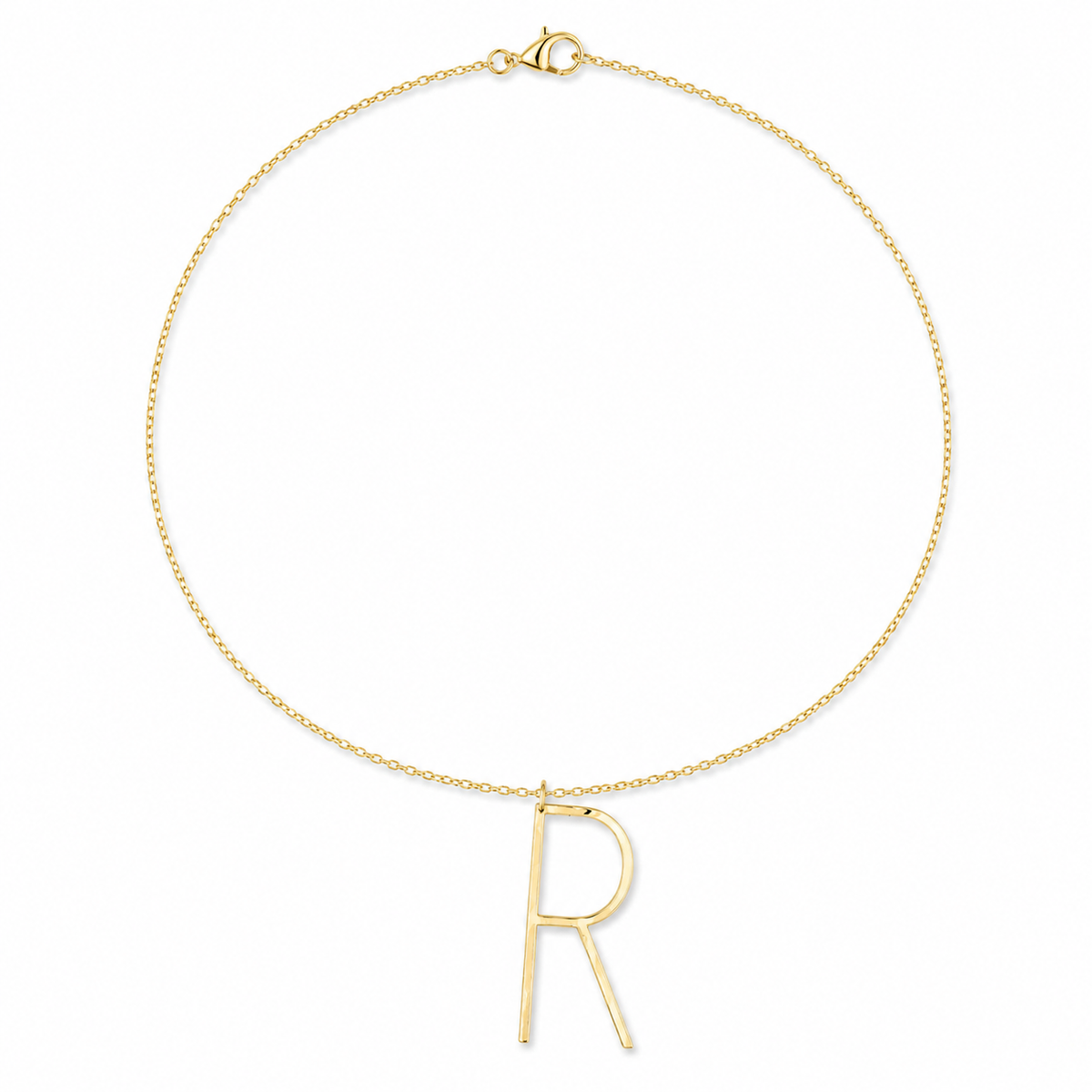 A delicate gold chain necklace featuring a minimalist, open capital letter 'R' pendant, displayed on a clean white background.