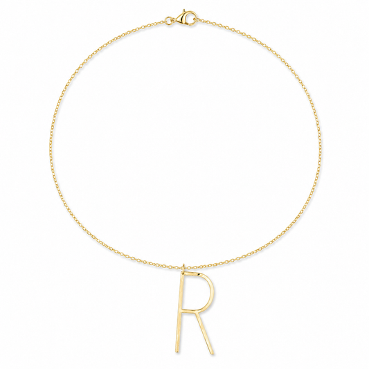 A delicate gold chain necklace featuring a minimalist, open capital letter 'R' pendant, displayed on a clean white background.