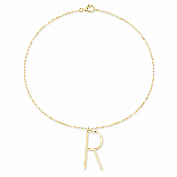 A delicate gold chain necklace featuring a minimalist, open capital letter 'R' pendant, displayed on a clean white background.