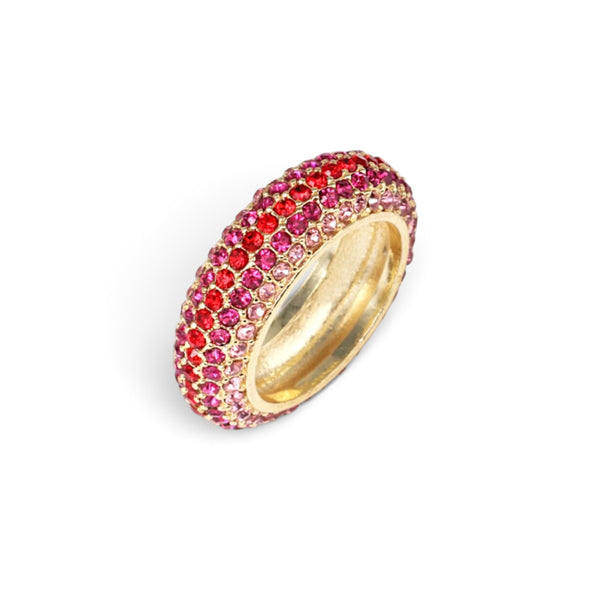 A gold ring with a double row of pavé-set pink and red gemstones, shown on a clean white background.