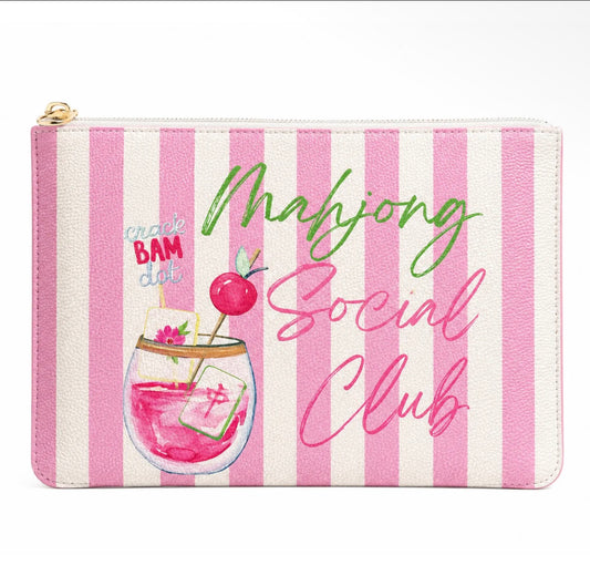 A zippered pouch with pink and white vertical stripes, featuring a colorful illustration of a pink cocktail and the text 'Mahjong Social Club' in green and pink script.