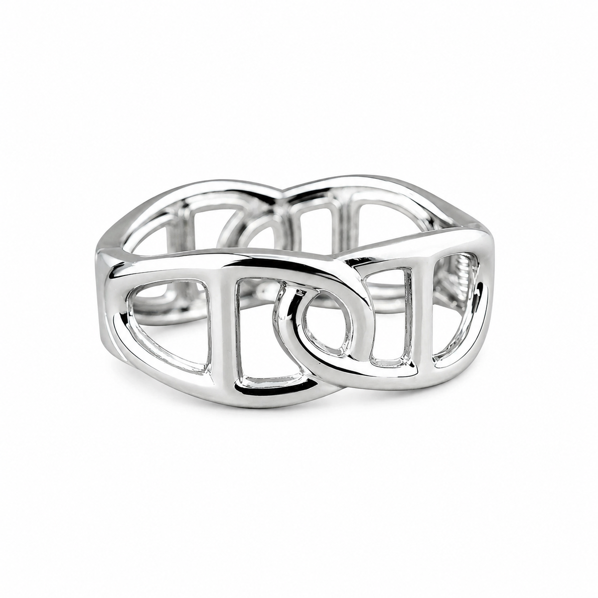 A polished silver-toned ring with an open, interlocking geometric design, photographed on a clean white background.