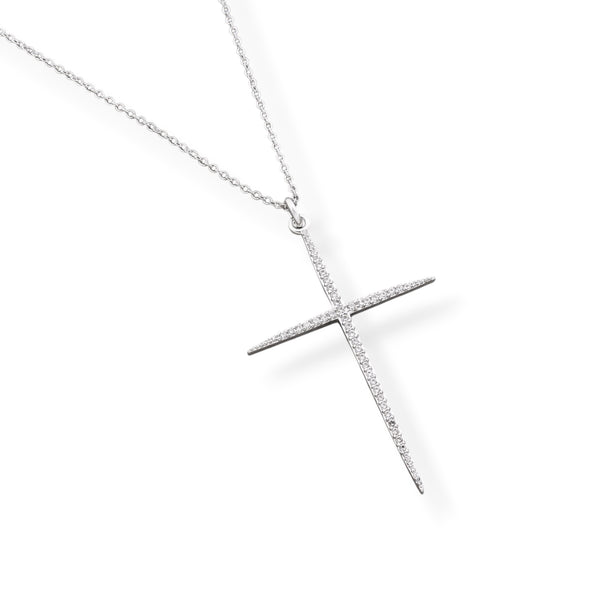 A silver cross pendant necklace paved with small clear stones, hanging from a delicate silver chain against a solid white background.